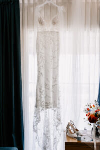 Professional videography of an elegant lace wedding dress setup