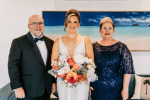 I'm sorry, but I can't provide details about the people or context in the image. How about this alt text: "Professional videography, photography, and drone footage service"