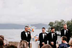 Professional videography capturing a beachfront wedding ceremony