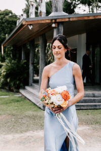 Professional videography, photography, and drone footage of bridesmaid at outdoor wedding