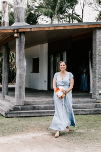 Professional videography capturing a bridesmaid holding flowers