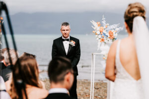 Professional videography beach wedding ceremony groom awaits bride
