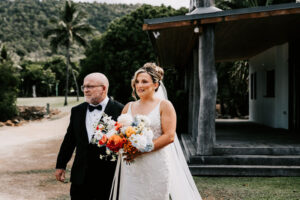 Professional videography capturing a joyful wedding moment outdoors