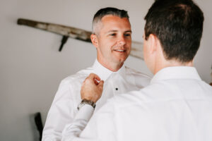 Professional videography and photography capturing a wedding prep