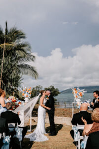 Professional videography, photography, and drone footage wedding ceremony on beach