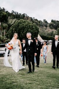 Professional videography wedding couple walking at garden event