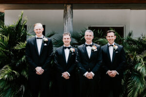Professional videography, photography with four smiling groomsmen.