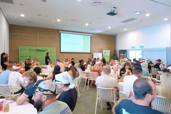 Professional videography, photography, and drone footage capture event gathering in modern conference room