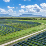 Professional videography, photography, and drone footage of scenic farmland landscape with mountains
