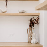 Decorative vases on open kitchen shelving