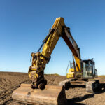 Professional videography capturing excavator on construction site