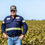 Professional videography photography drone footage of farmer in field