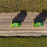 Professional videography capturing aerial view of farming machinery