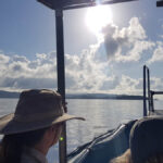 Professional videography boat scene on a lake with cloudy sky