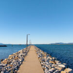 Professional videography photography and drone footage of a pier