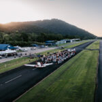 Professional videography, photography, and drone footage at sunset airport runway scene.