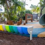 Professional videography colorful playground equipment and slide