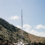 Professional videography yacht anchored in tranquil blue sea