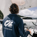 Professional videography capturing a person steering a boat