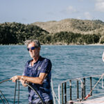 Professional videography of man sailing on blue ocean waters