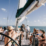 Professional videography group enjoying a sunny boat trip