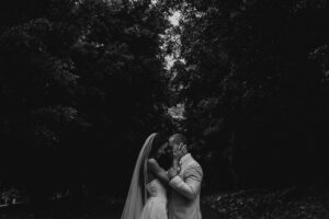 Professional videography of couple embracing in forest setting