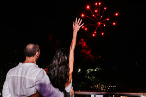Professional videography capturing couple watching fireworks display
