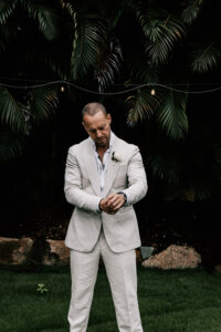Professional videography of a man in a light suit outdoors