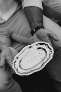Professional videography capturing elegant engraved metal plaque