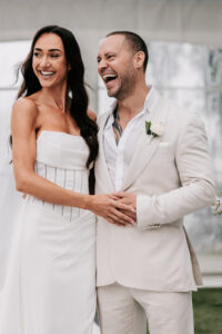 Professional videography couple in elegant wedding attire