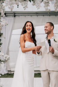 Professional videography wedding couple smiling during speeches