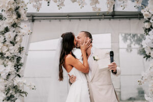 Professional videography of a couple kissing at their wedding