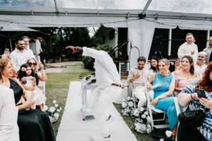 Professional videography capturing joyful outdoor wedding moments