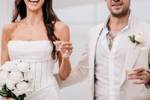 Professional videography wedding couple with bouquets and drinks