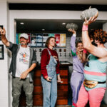 Professional videography photography and people celebrating indoors