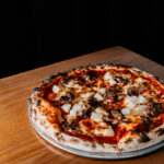 Professional videography photography drone footage pizza on table