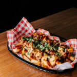 Professional videography and photography of loaded fries platter