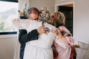 Professional videography captures joyful family embrace indoors