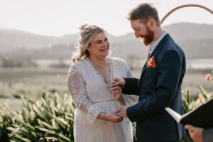 Professional videography and photography at outdoor wedding ceremony