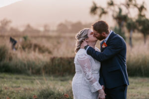 Professional videography photography drone footage wedding kiss