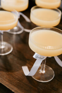 Professional videography cocktail glasses with celebration ribbon