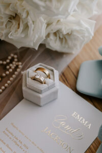 Professional videography captures elegant wedding invitation setup