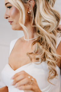 Professional videography elegant bride with blonde wavy hairstyle