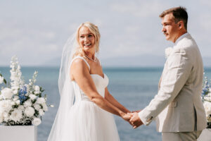 Professional videography photography drone footage of a beach wedding