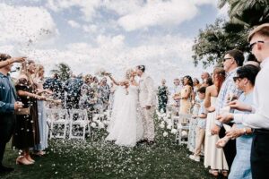 Professional videography capturing outdoor wedding celebration