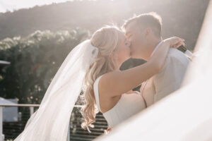 Professional videography photography and drone footage wedding kiss