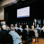 Professional videography conference with speaker on stage
