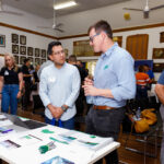 Professional videography team networking at a creative expo event