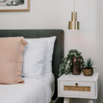 Bedroom and bedside table at 208 Boathouse