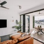Living room opening onto the balcony at 208 Boathouse